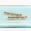 Picture of Edwardian Era Pair Of 14K Yellow Gold, Seed Pearl & White Enamel Bar Brooches