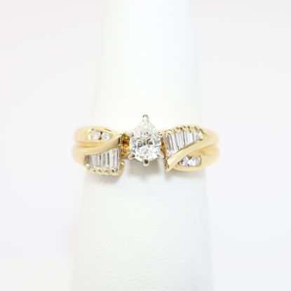 Picture of 14K Yellow Gold, Pear Brilliant Cut Diamond Solitaire & Diamond Cluster Accented Two-Piece Bridal Ring Set