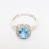 Picture of Blue Topaz ring with Diamond Halo in 10k White Gold