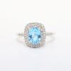 Picture of Blue Topaz ring with Diamond Halo in 10k White Gold