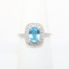 Picture of Blue Topaz ring with Diamond Halo in 10k White Gold