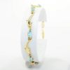 Picture of 14k Yellow Gold & Oval Cut Blue Topaz Bracelet with Dolphin Shaped Links