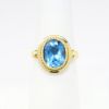 Picture of 18k Yellow Gold & Bezel Set Oval Cut Blue Topaz Ring