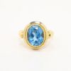 Picture of 18k Yellow Gold & Bezel Set Oval Cut Blue Topaz Ring