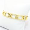 Picture of 'Atlas' Roman Numeral Cuff Bracelet by Tiffany & Co. in 18k Yellow Gold