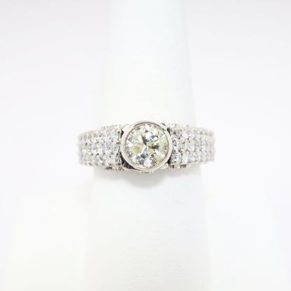 Picture of 18k White Gold Round Brilliant Cut Diamond Ring with Pavé Set Diamond Band