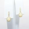 Picture of 14k Yellow Gold & Oval Opal Cabochon Drop Earrings with Diamond Accents