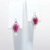 Picture of 14k White Gold & Oval Cut Ruby Huggie Earrings with Diamond Halos