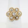 Picture of Textured 14k Yellow Gold 7 Halo Ring with Round Brilliant Cut Diamond Centers
