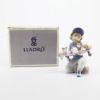 Picture of Lladro Porcelain 1994 Event Figurine 'Little Riders' #7623, Boy with Skateboard Full of Kittens with Box