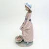 Picture of Lladro 'Flowers In The Basket' Girl With Flowers Figurine  #5027